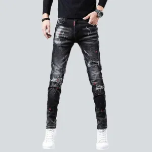 Ripped slightly painted men's jeans