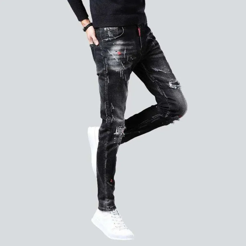 Ripped slightly painted men's jeans