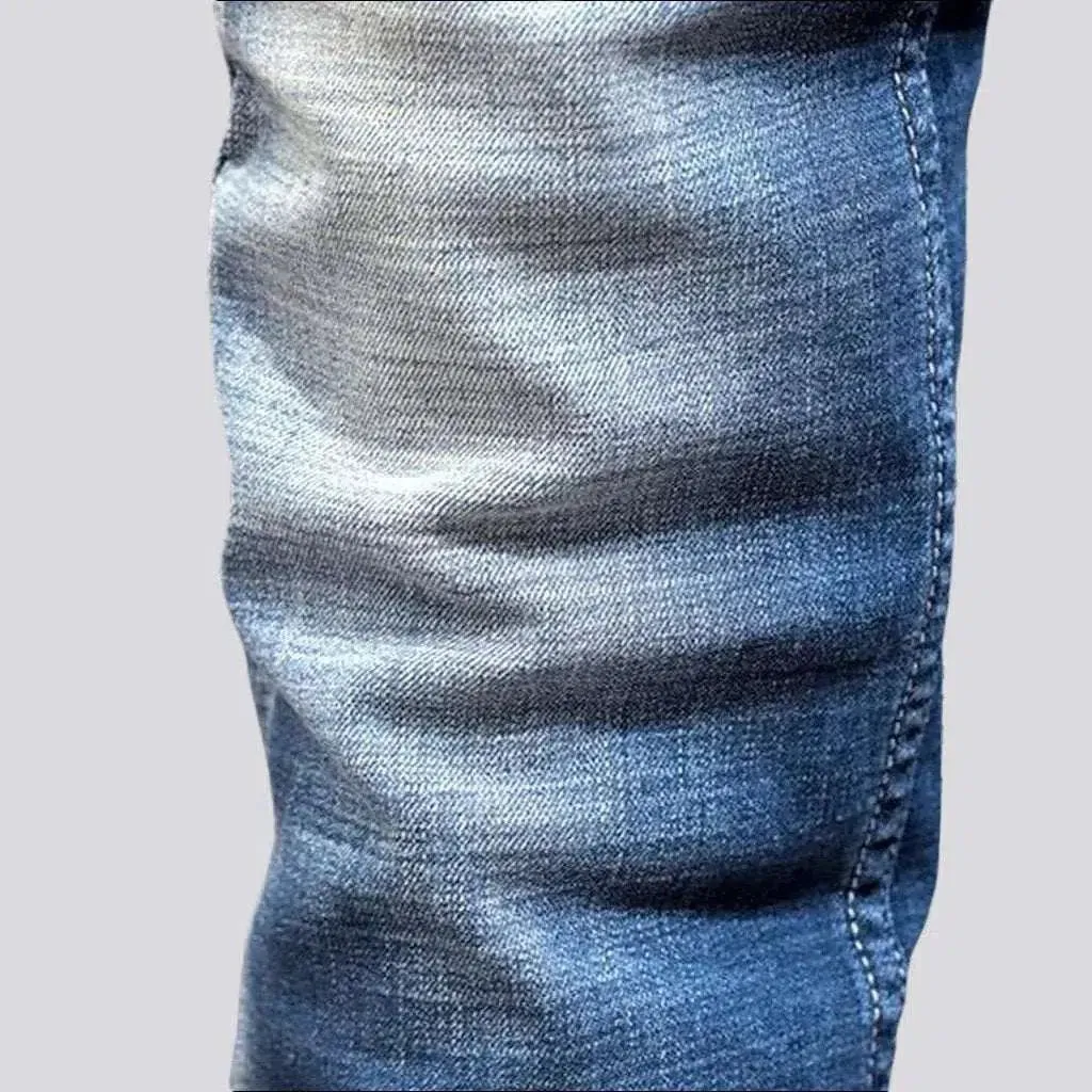 Sanded men's whiskered jeans